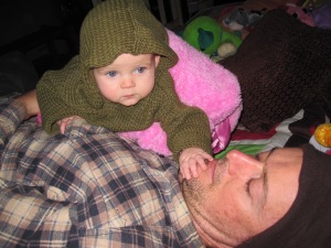 Miss Snugglebug with Daddy, in a jumper I knitted her.